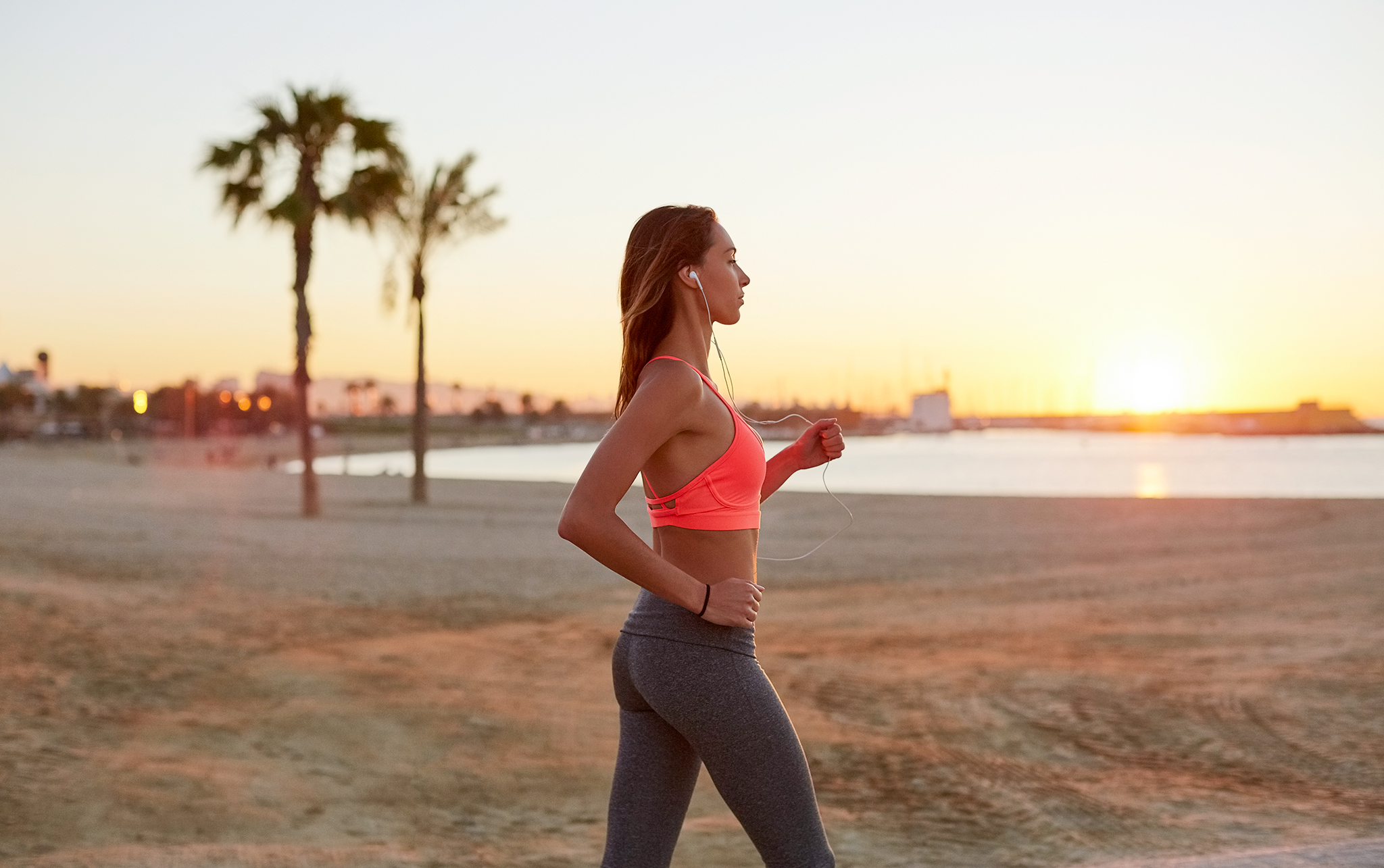 how to start running girl walking on the beach