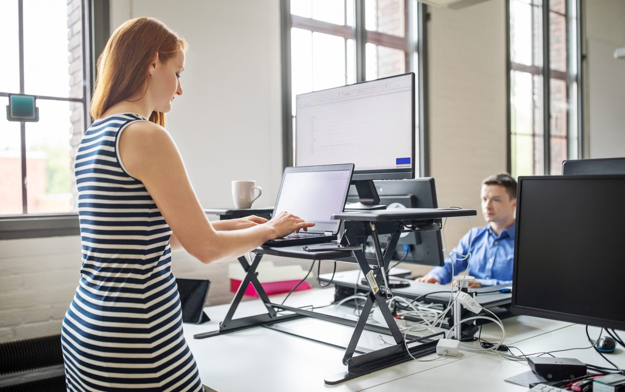 standing up working at computer